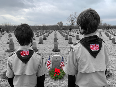 (L to R) Scout Pack 178 brothers Zack (13) and Max (15) Moland pay respects at gravesite of CPL Peter J. Courcy, the namesake of Post 178, during 2020 Wreaths Across America activities at DFW National Cemetery (2020 Photo by Michael Moland)
